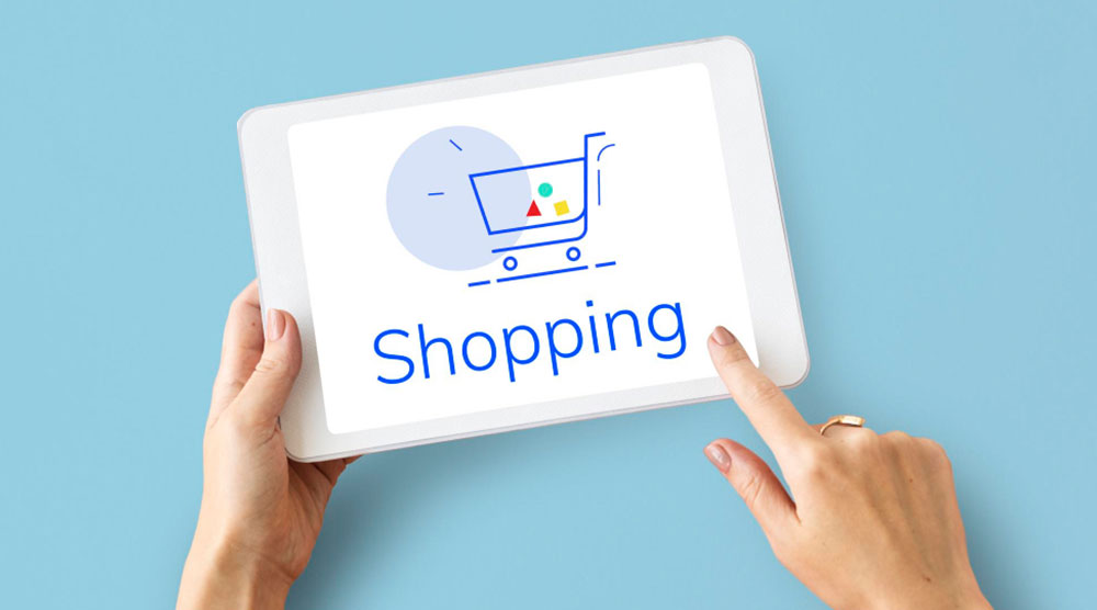 Einkaufswagen-Symbol und Schriftzug mit "Shopping" auf Bildschirm