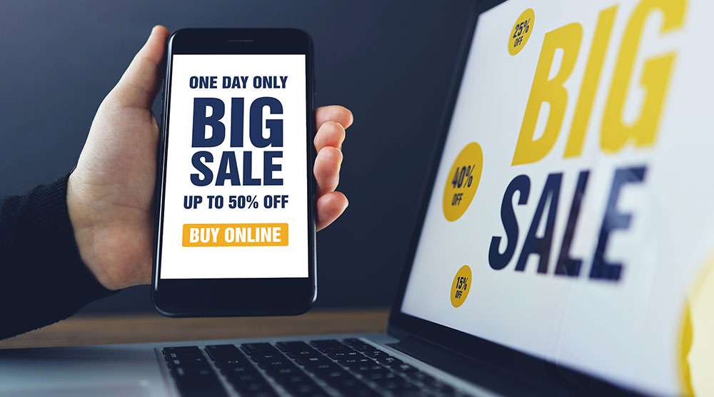 zwei Bildschirme mit "Big Sale"